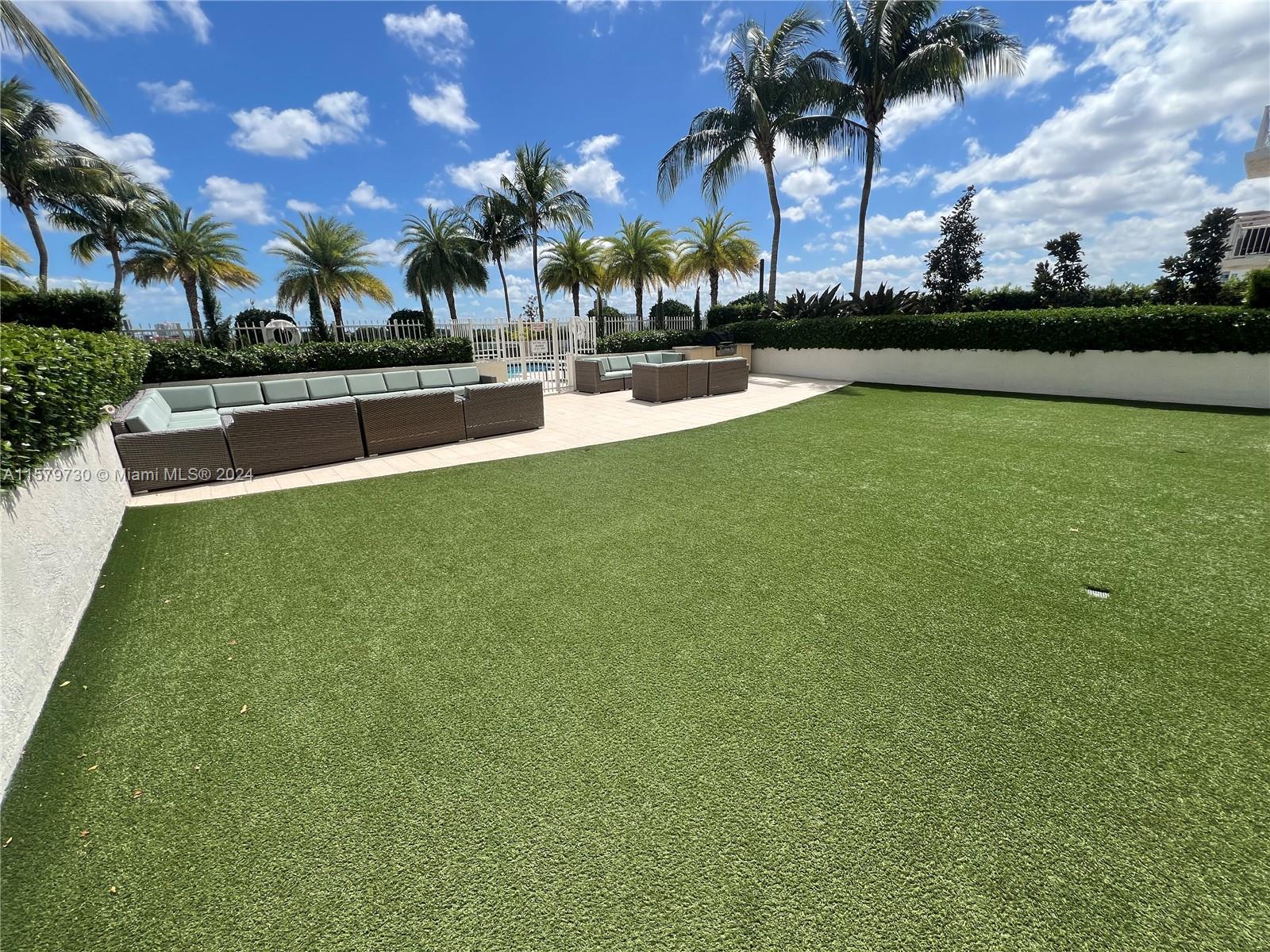 3000 Coral Way, Unit 703 Miami, FL 33145 - Photo 25 of 26 a swimming pool with outdoor seating and yard