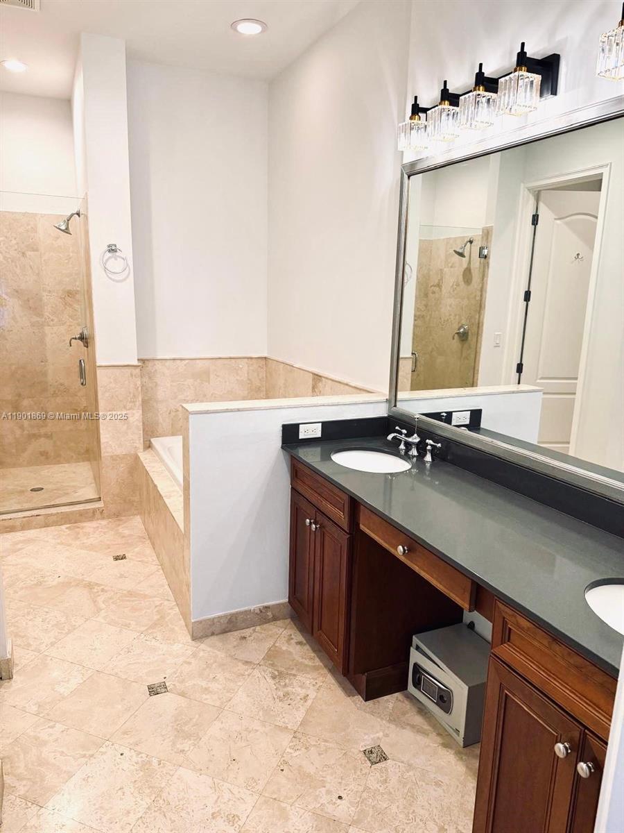 7765 Southwest 54th Court, Unit 7765 Miami, FL 33143 - Photo 14 of 30 a bathroom with a sink and a mirror