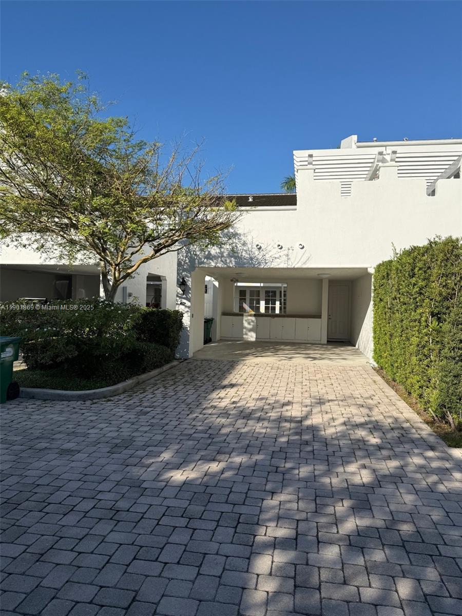7765 Southwest 54th Court, Unit 7765 Miami, FL 33143 - Photo 30 of 30 a view of a terrace with a bench