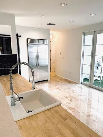 a room with gym equipment and a window