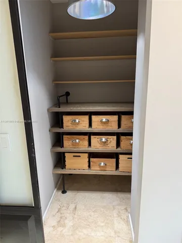 a view of small space with racks on the wall