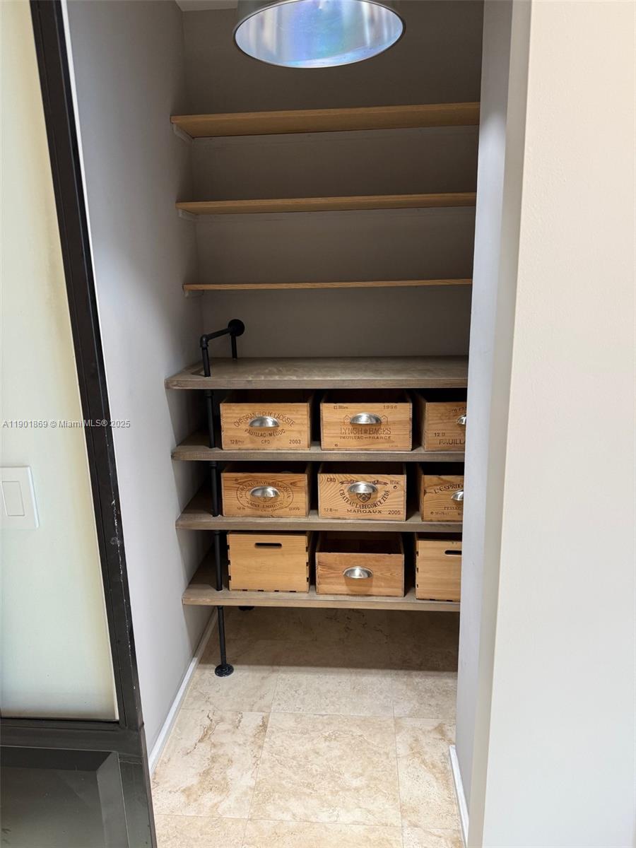 7765 Southwest 54th Court, Unit 7765 Miami, FL 33143 - Photo 7 of 30 a view of small space with racks on the wall