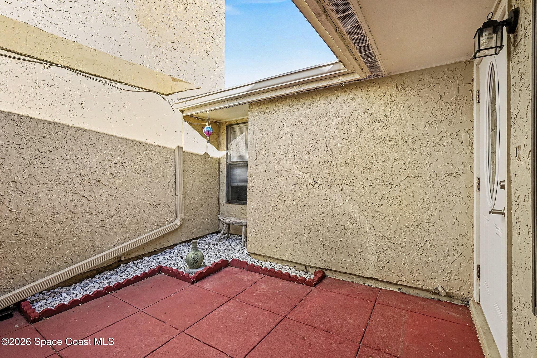 1491 Sheafe Avenue Northeast, Unit 104 Palm Bay, FL 32905 - Photo 13 of 19 a view of a yard