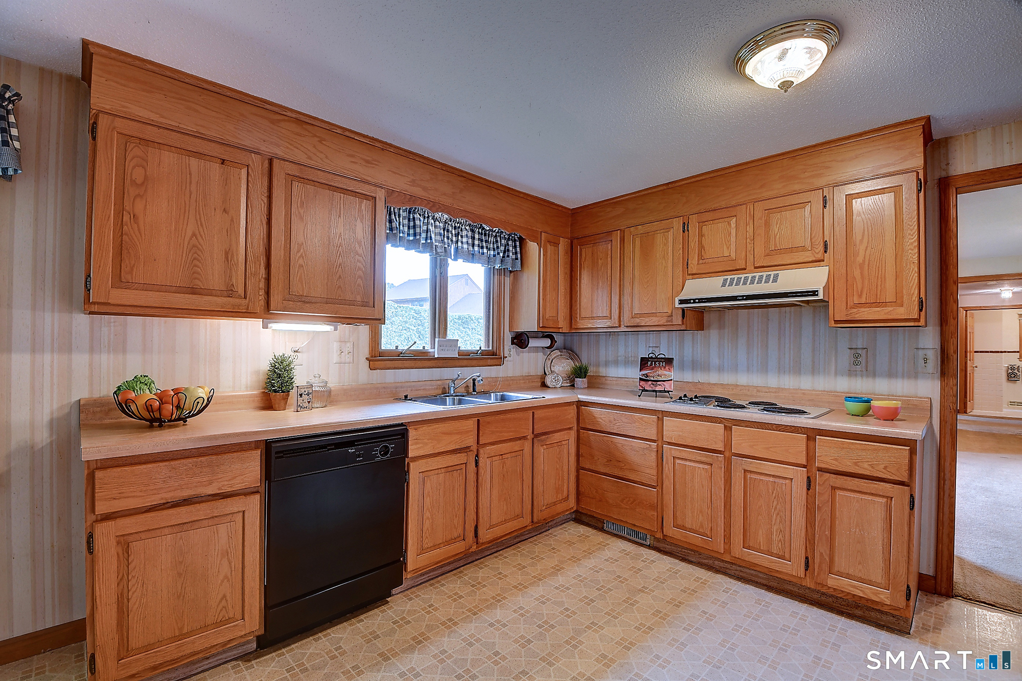 80 Grist Mill Road Wethersfield, CT 06109 - Photo 20 of 40 a kitchen with a sink stove and cabinets
