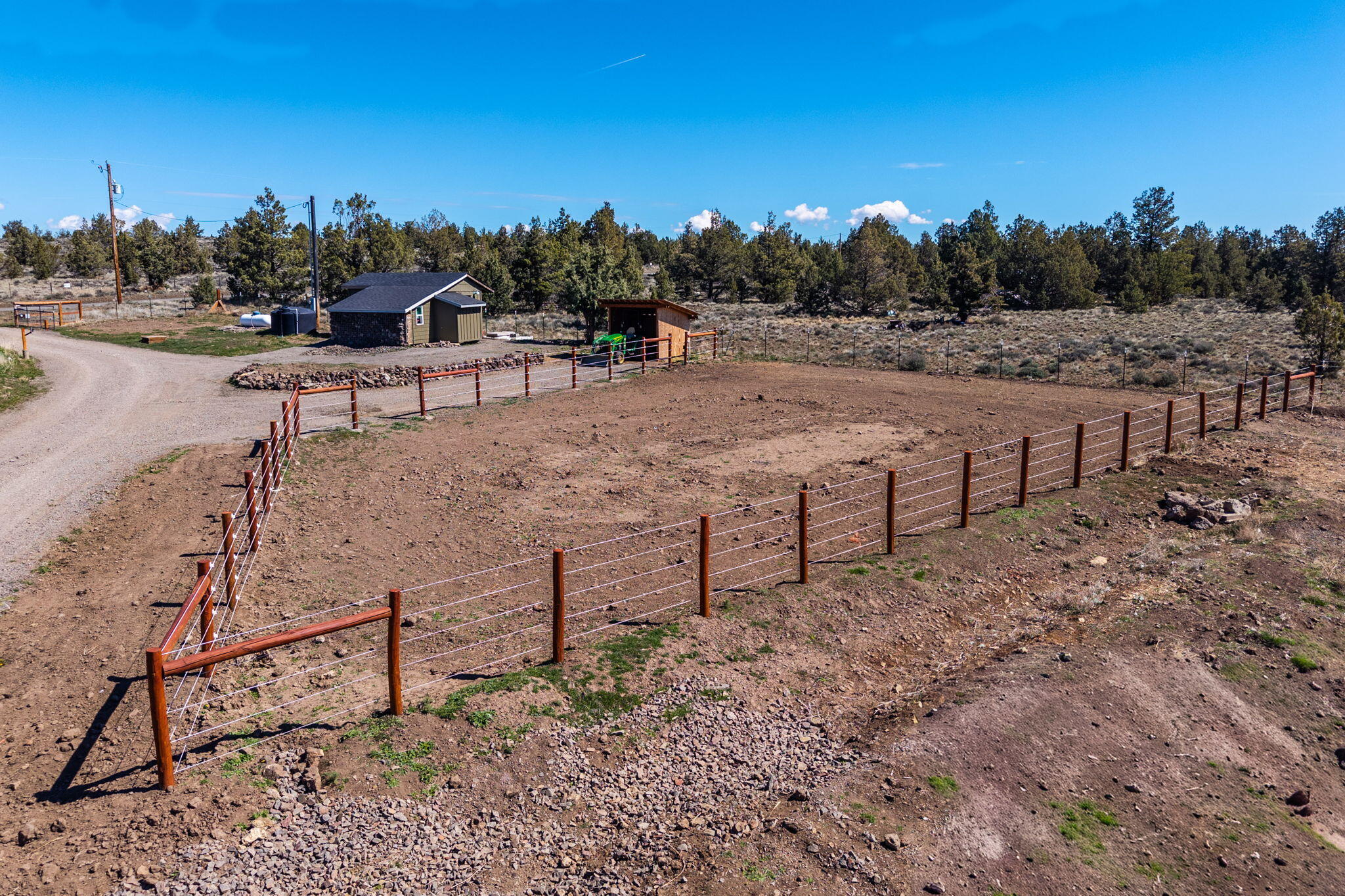 6040 Gravett Road Prineville, OR 97754 - Photo 66 of 77 Fenced are with electric fencing in place. Water and hay shed in place
