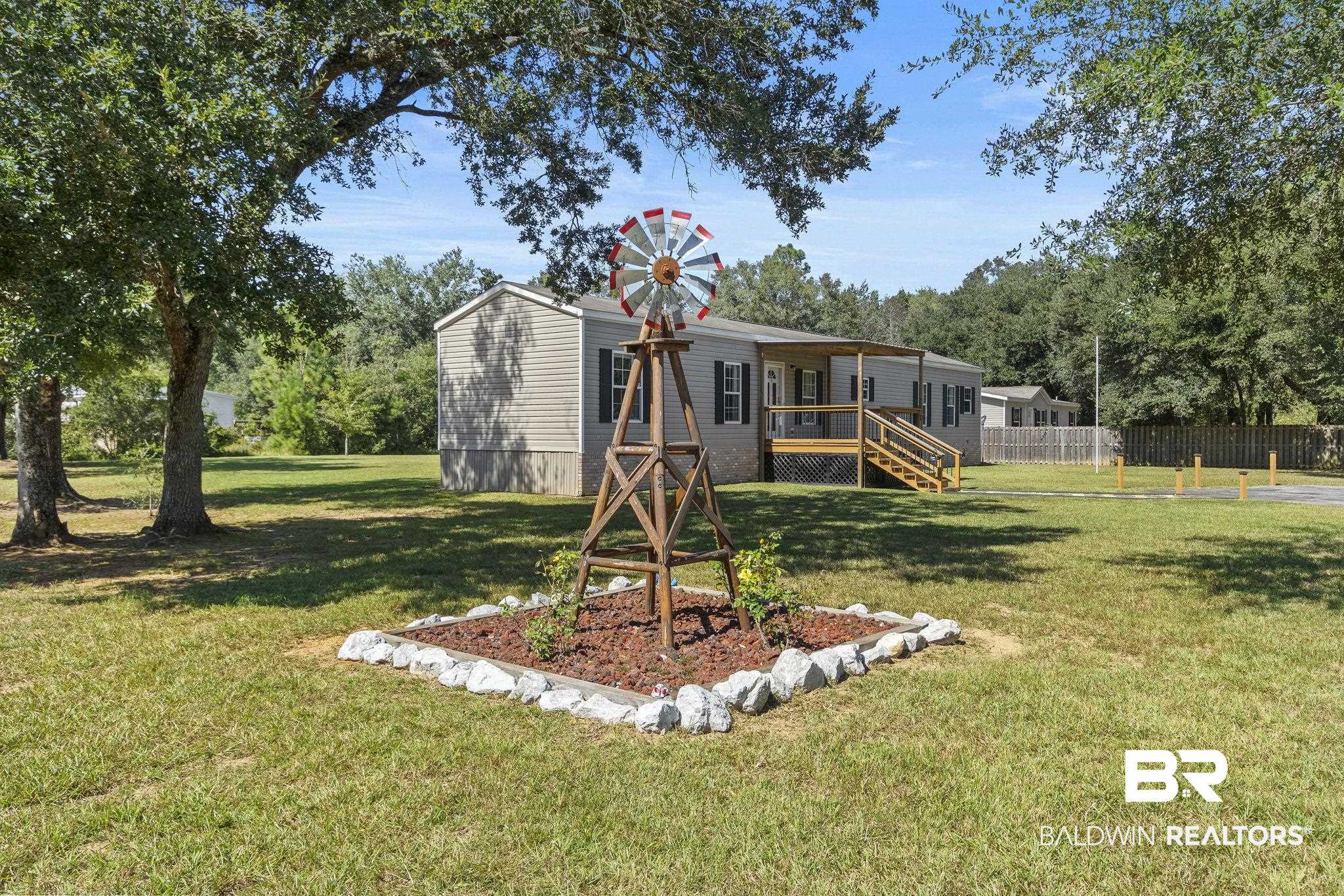 6870 Cecilia Court Theodore, AL 36582 - Photo 61 of 83 View of yard featuring a wooden deck