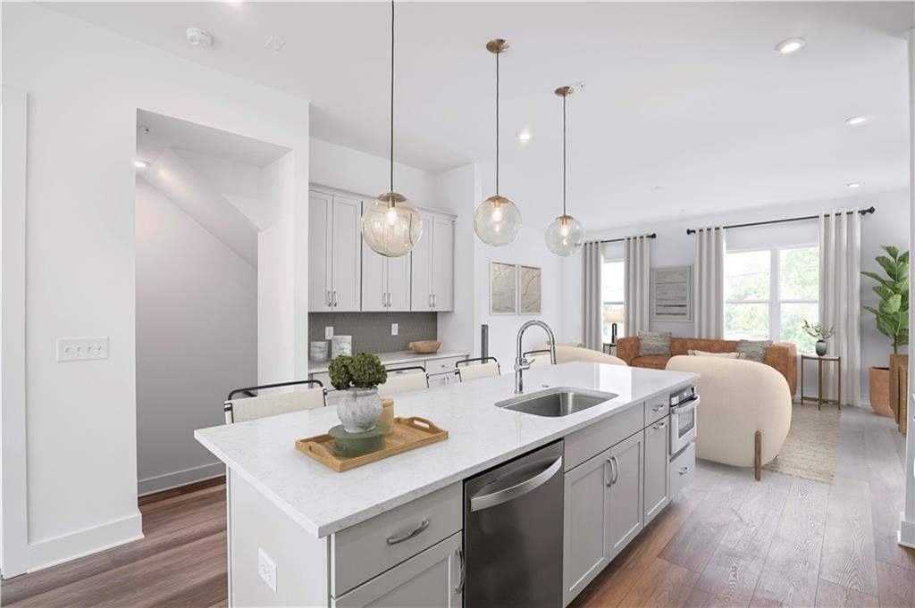 508 Motivation Circle Northwest Atlanta, GA 30318 - Photo 2 of 25 a kitchen with a sink stove and wooden floor