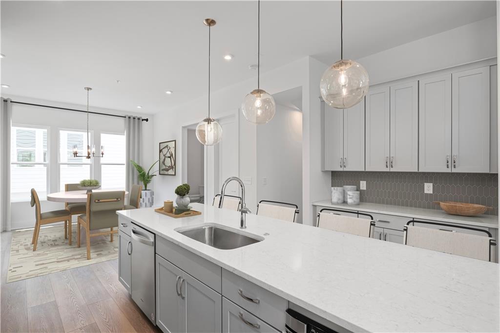 508 Motivation Circle Northwest Atlanta, GA 30318 - Photo 3 of 25 a kitchen with appliances a sink and cabinets