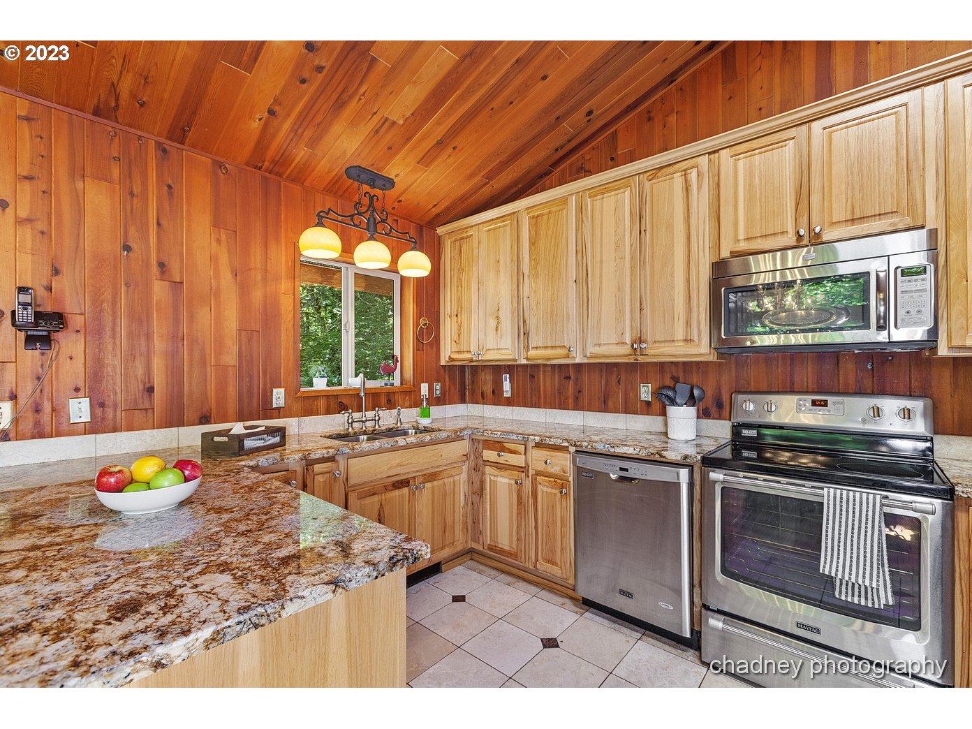 2847 Northeast Brower Road Corbett, OR 97019 - Photo 15 of 48 a kitchen with a stove a sink and a microwave