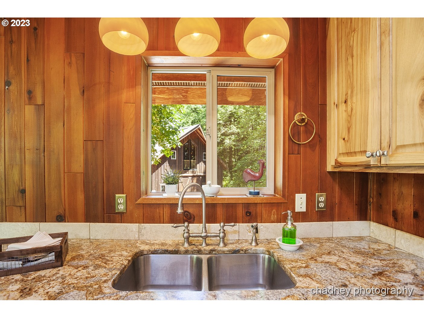 2847 Northeast Brower Road Corbett, OR 97019 - Photo 16 of 48 a kitchen with a window and wooden cabinets