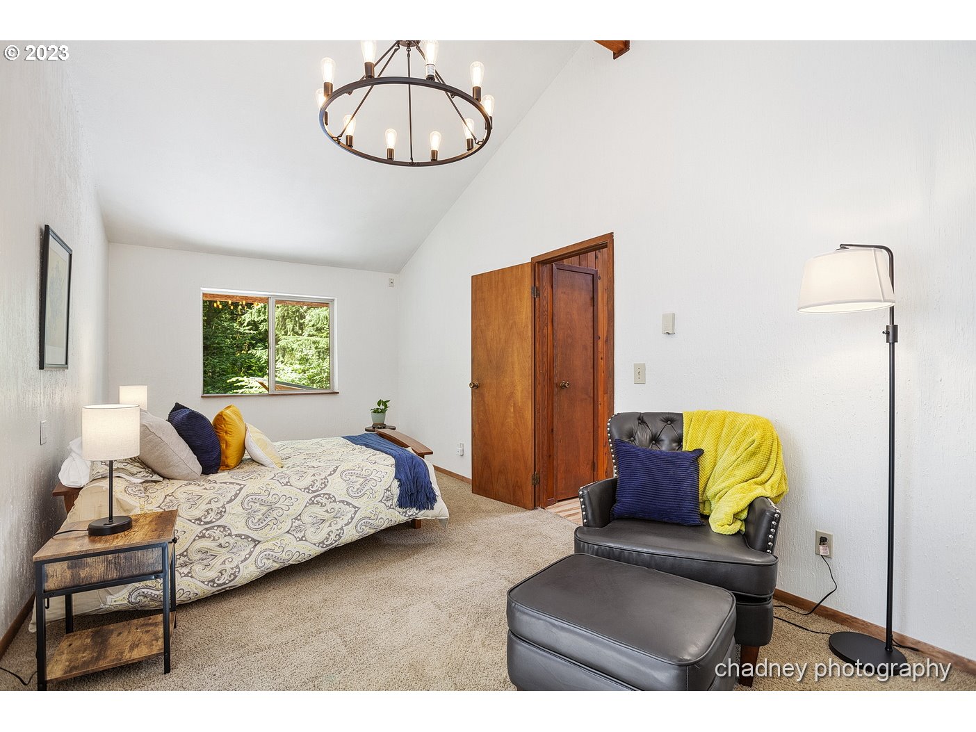 2847 Northeast Brower Road Corbett, OR 97019 - Photo 17 of 48 a bedroom with a bed lamp and window
