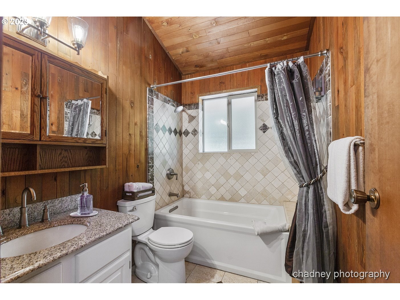 2847 Northeast Brower Road Corbett, OR 97019 - Photo 19 of 48 a bathroom with a granite countertop sink toilet and shower