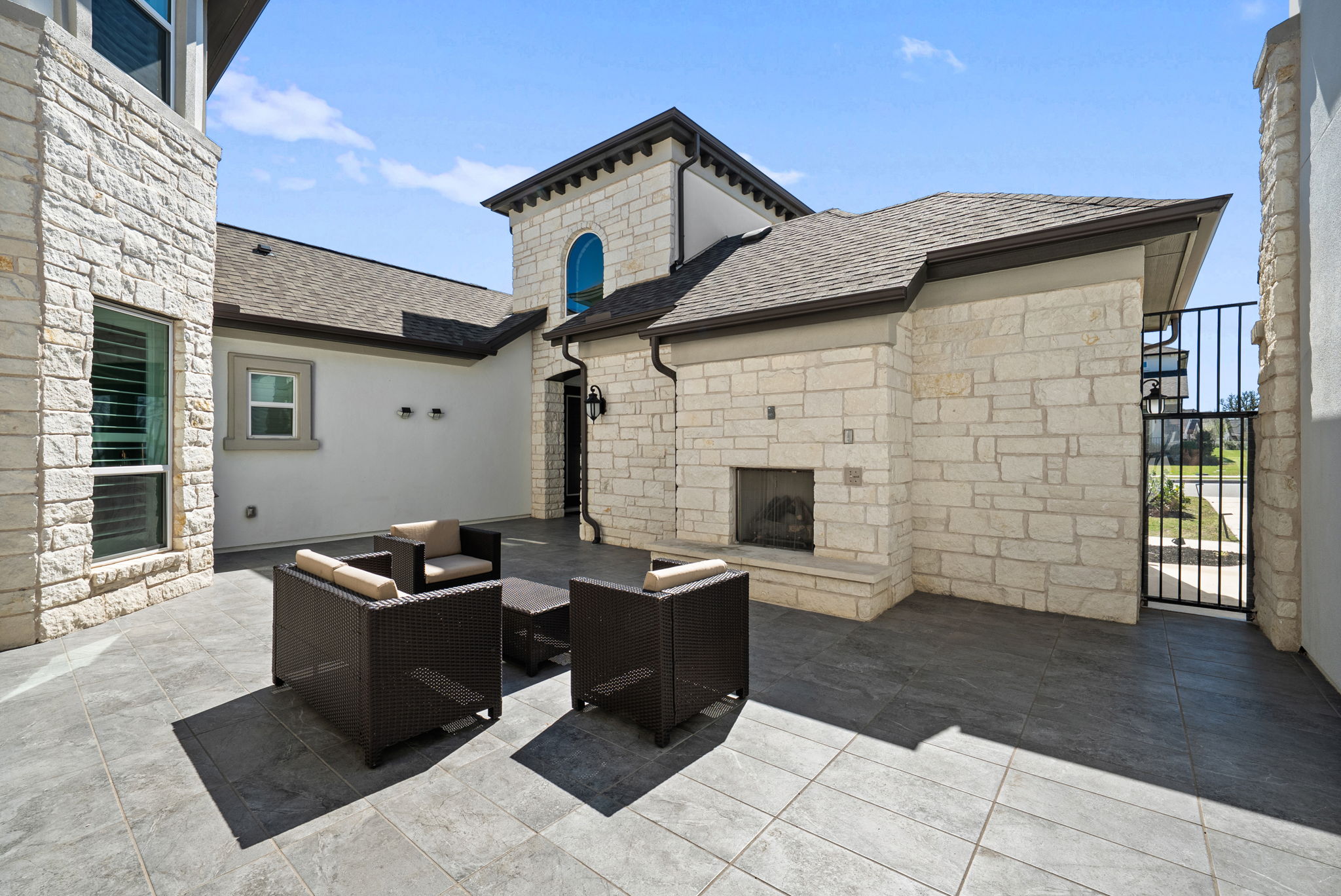 2132 Novara Trail Leander, TX 78641 - Photo 10 of 40 View of patio / terrace with an outdoor living space with a fireplace