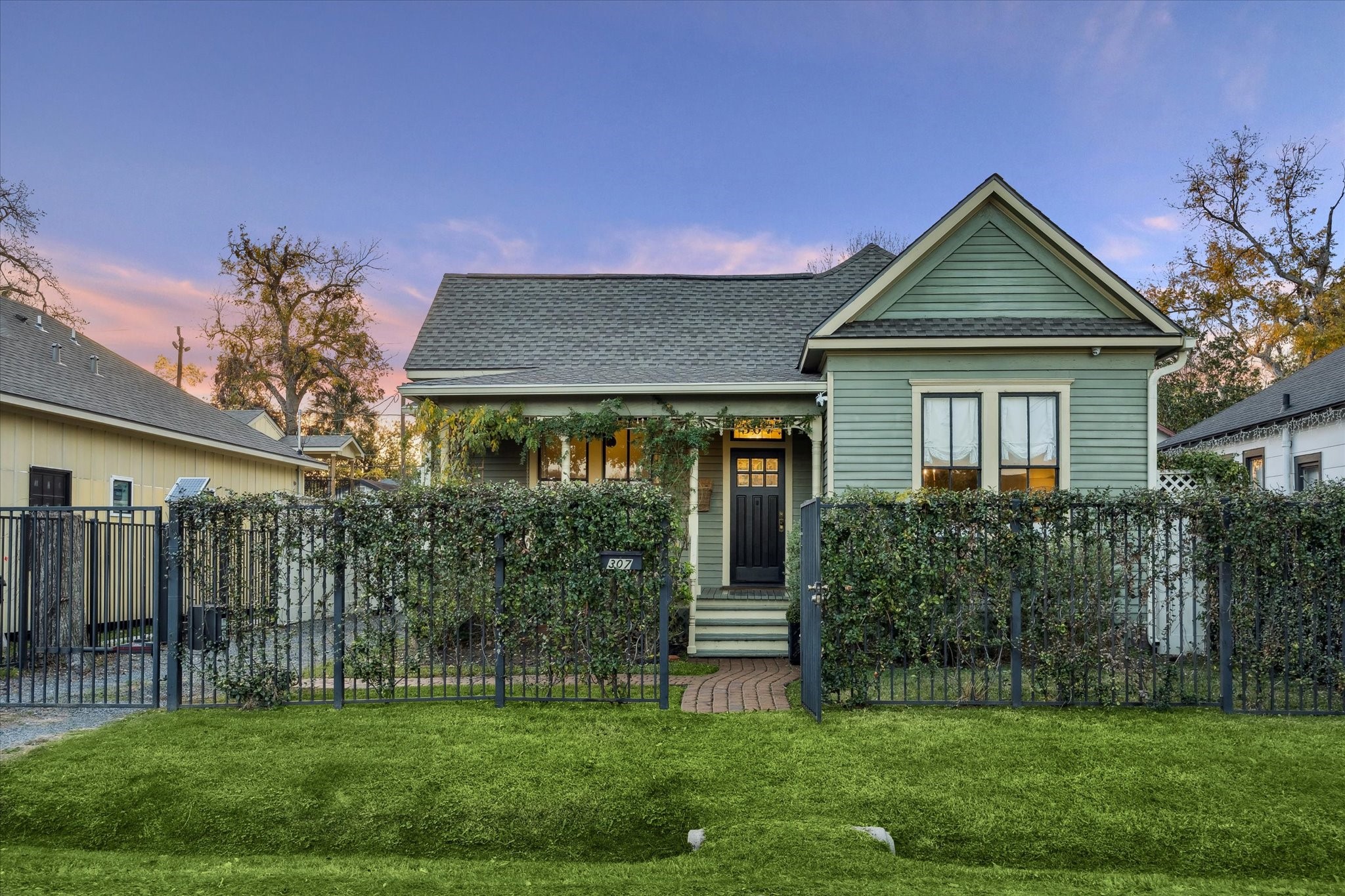 a front view of a house with a yard
