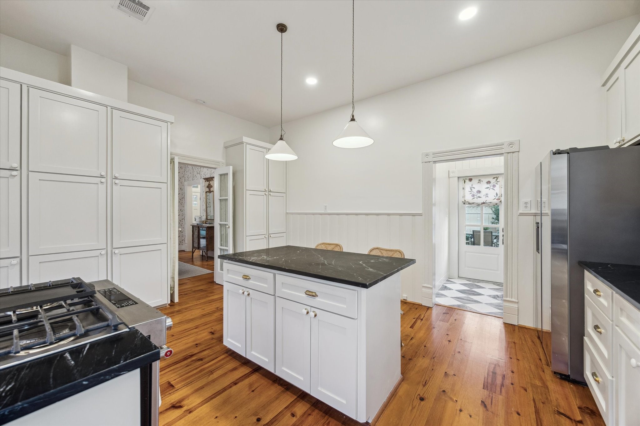 307 Archer Street Houston, TX 77009 - Photo 12 of 26 a kitchen with granite countertop a stove and a refrigerator
