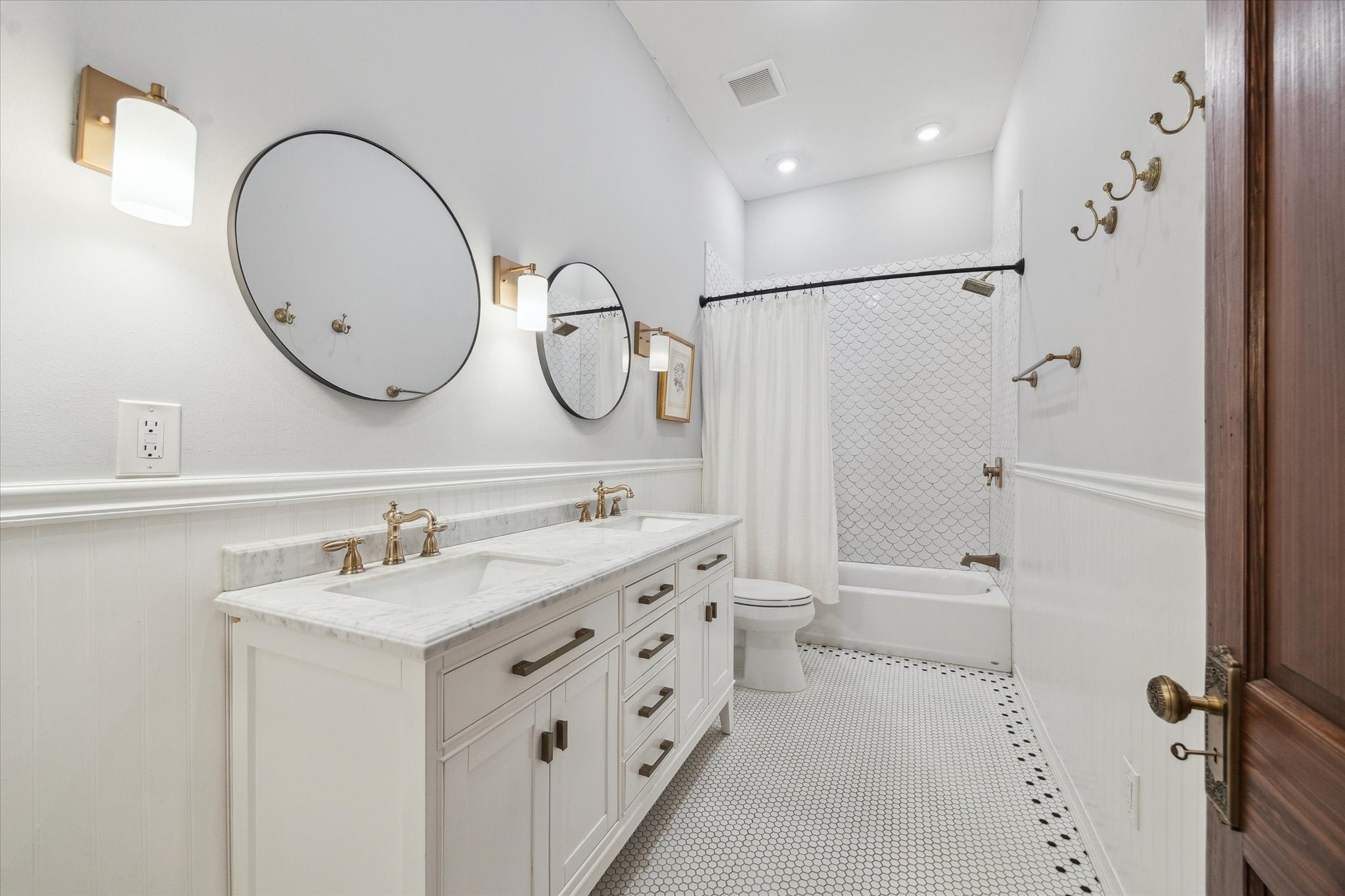 307 Archer Street Houston, TX 77009 - Photo 15 of 26 a bathroom with a sink a mirror a vanity and a shower