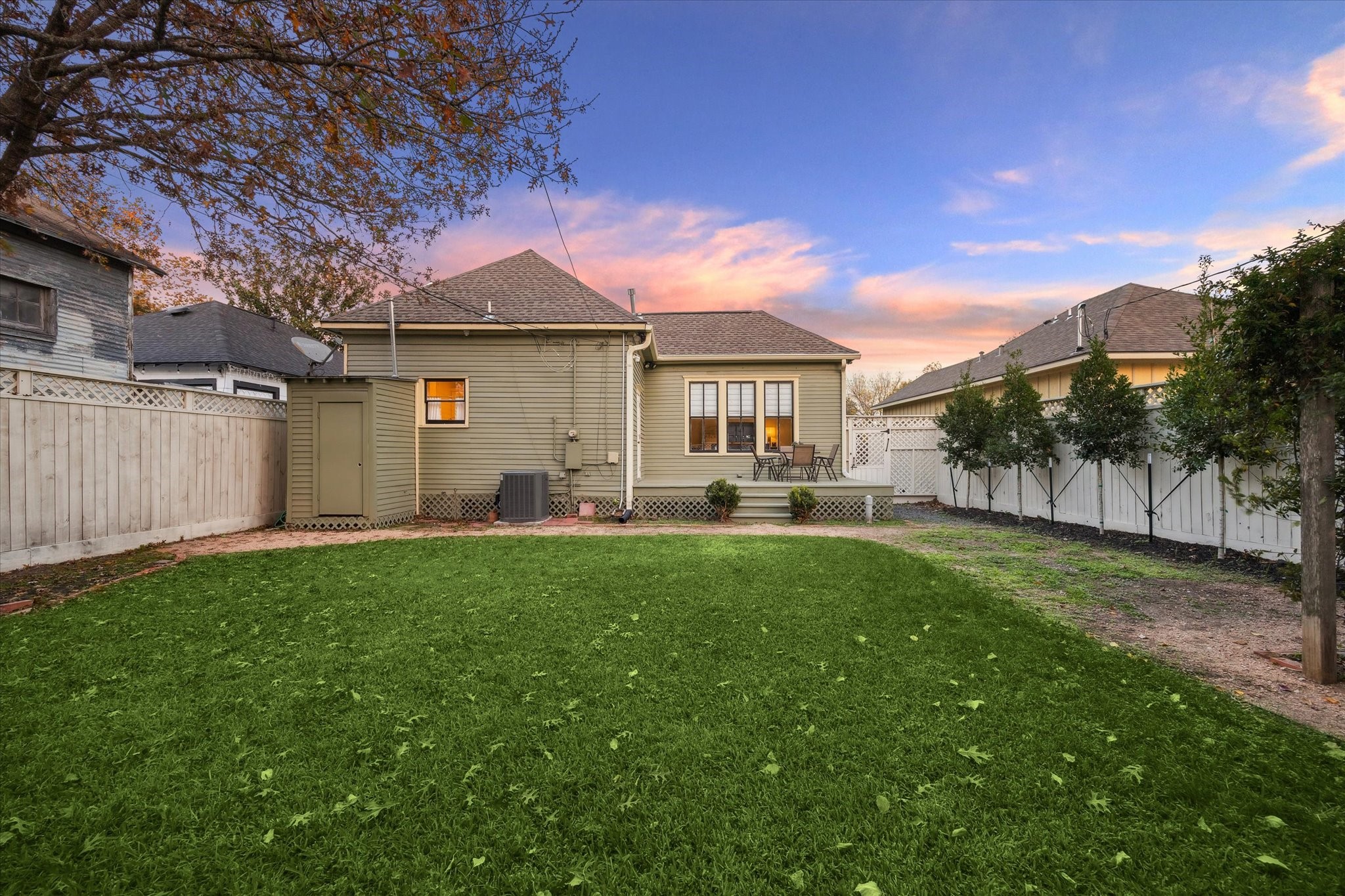307 Archer Street Houston, TX 77009 - Photo 24 of 26 a front view of a house with a yard and a tree