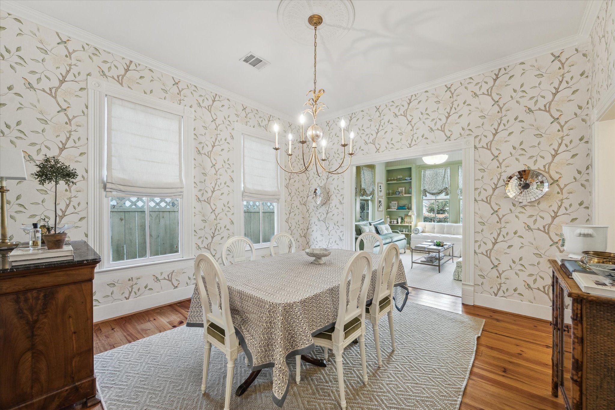 307 Archer Street Houston, TX 77009 - Photo 7 of 26 a dining room with wooden floor and a chandelier