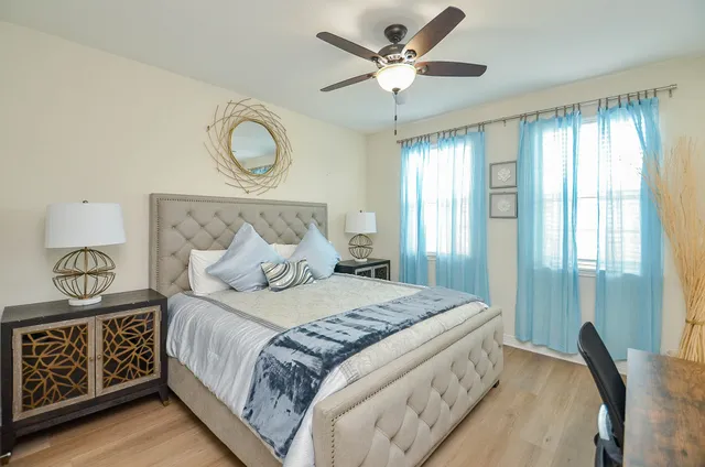 a bedroom with a bed and window