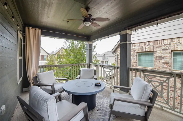 a view of a patio with a table chairs and a table