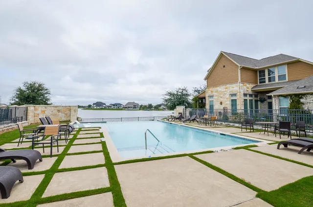 a view of a swimming pool with lounge chair