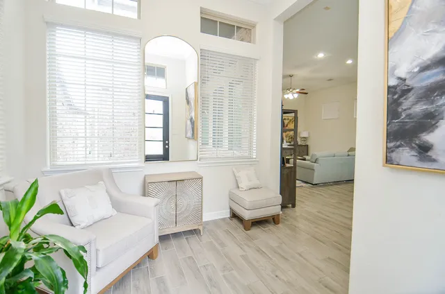 a living room with furniture and a large window