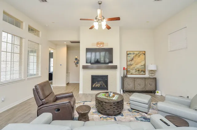 a living room with furniture and a fireplace