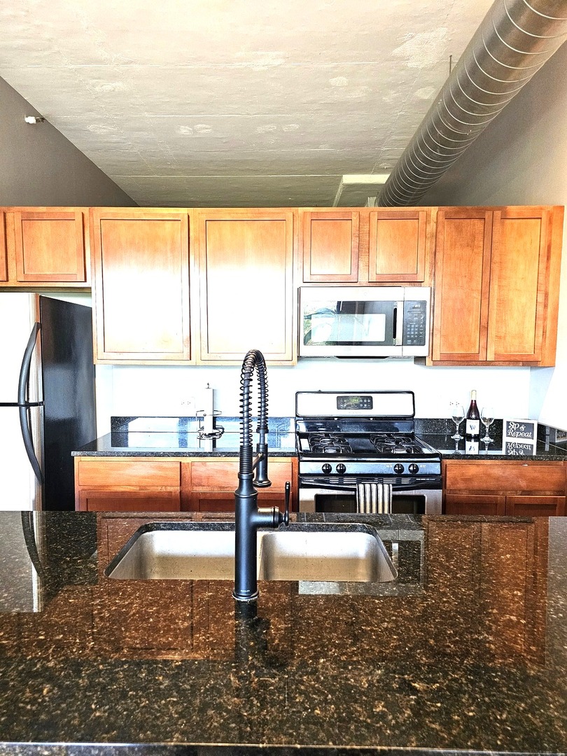 2323 West Pershing Road, Unit 230 Chicago, IL 60609 - Photo 11 of 39 a living room with large window