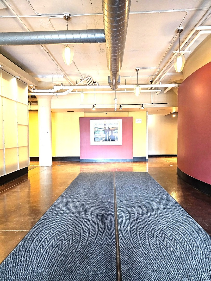 2323 West Pershing Road, Unit 230 Chicago, IL 60609 - Photo 32 of 39 a view of an empty room and window