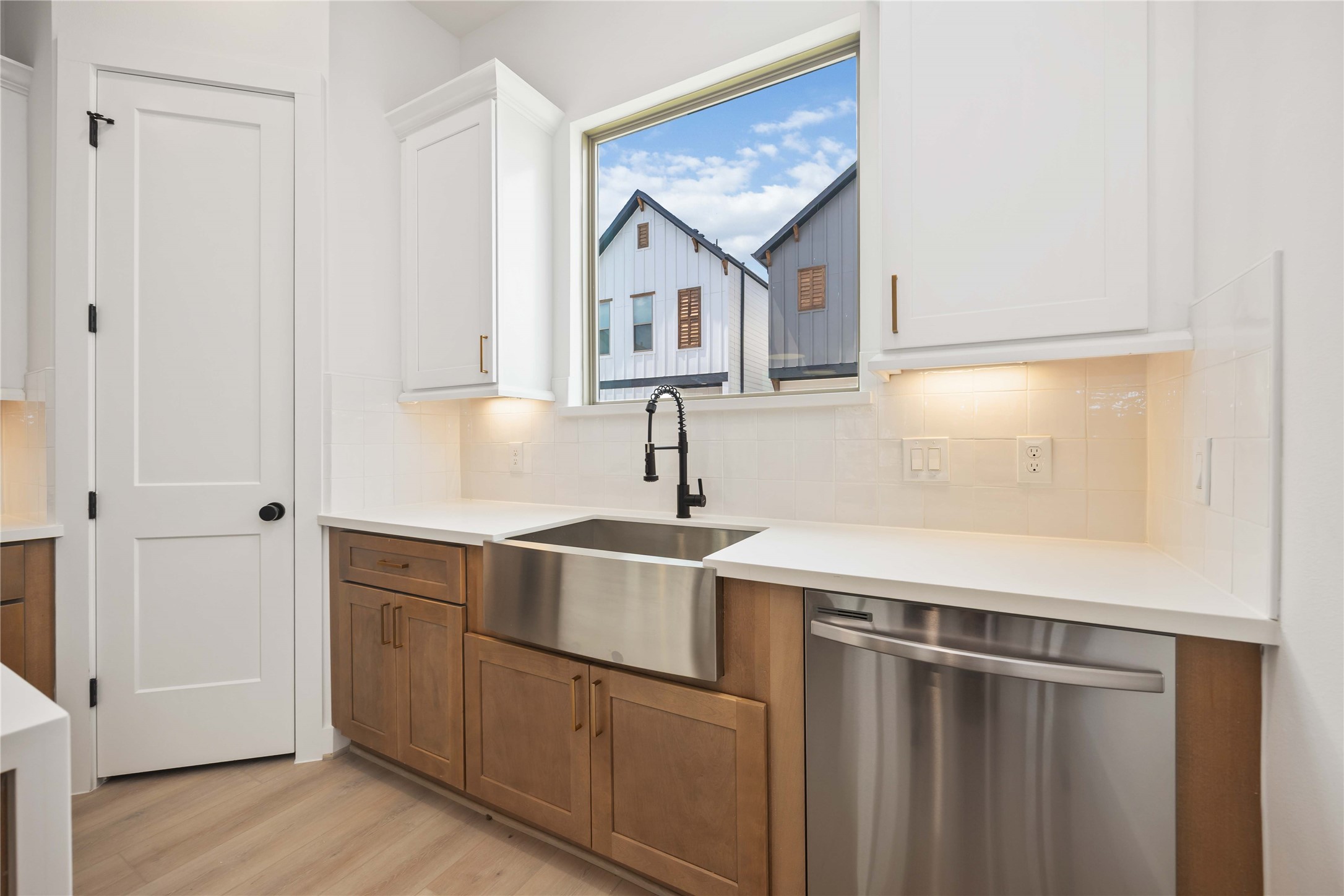 7807 Amelia Road, Unit B Houston, TX 77055 - Photo 9 of 30 a kitchen with a sink and cabinets