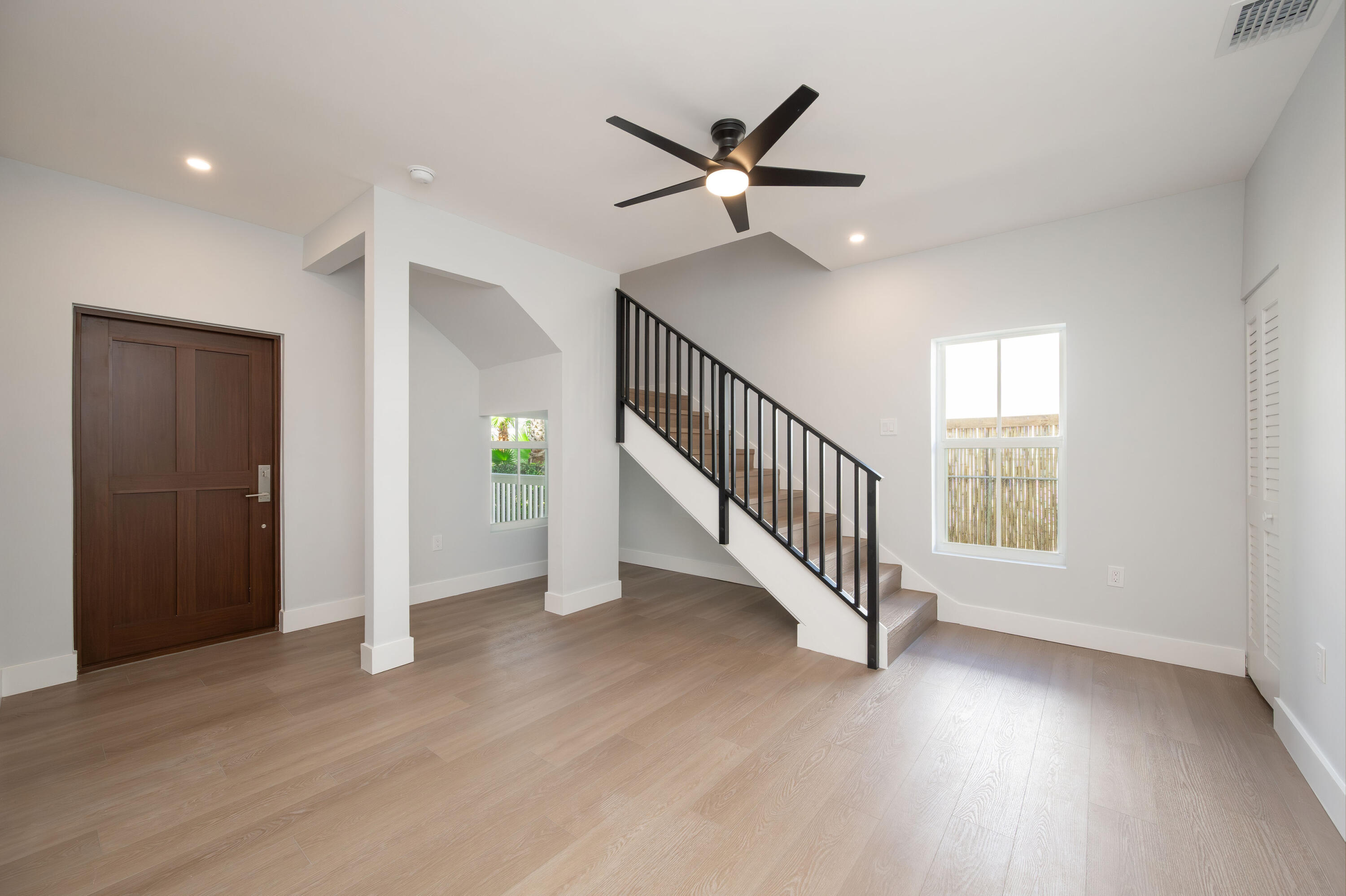 1315 William Street Key West, FL 33040 - Photo 11 of 26 a view of an entryway with wooden floor and staircase