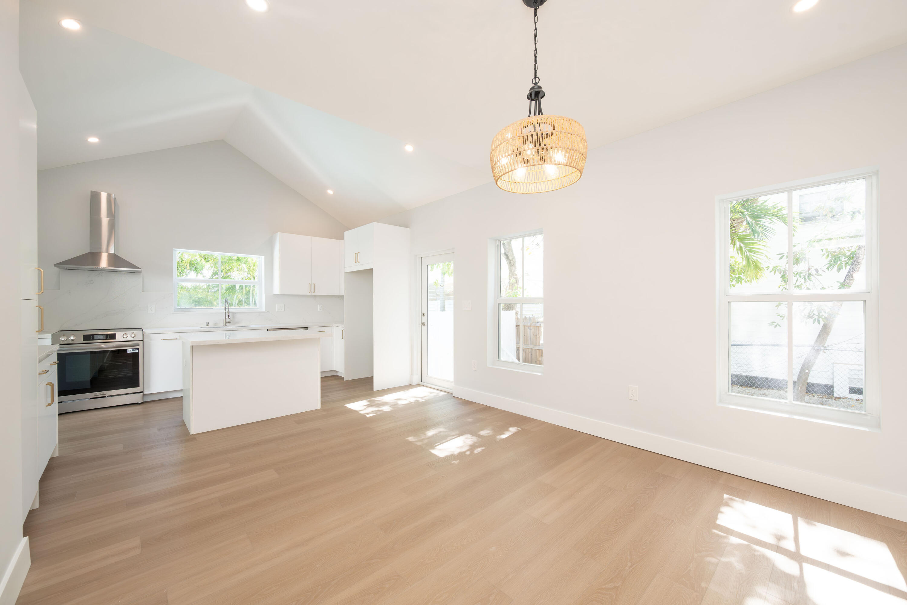 1315 William Street Key West, FL 33040 - Photo 12 of 26 a view of an empty room with a kitchen and window