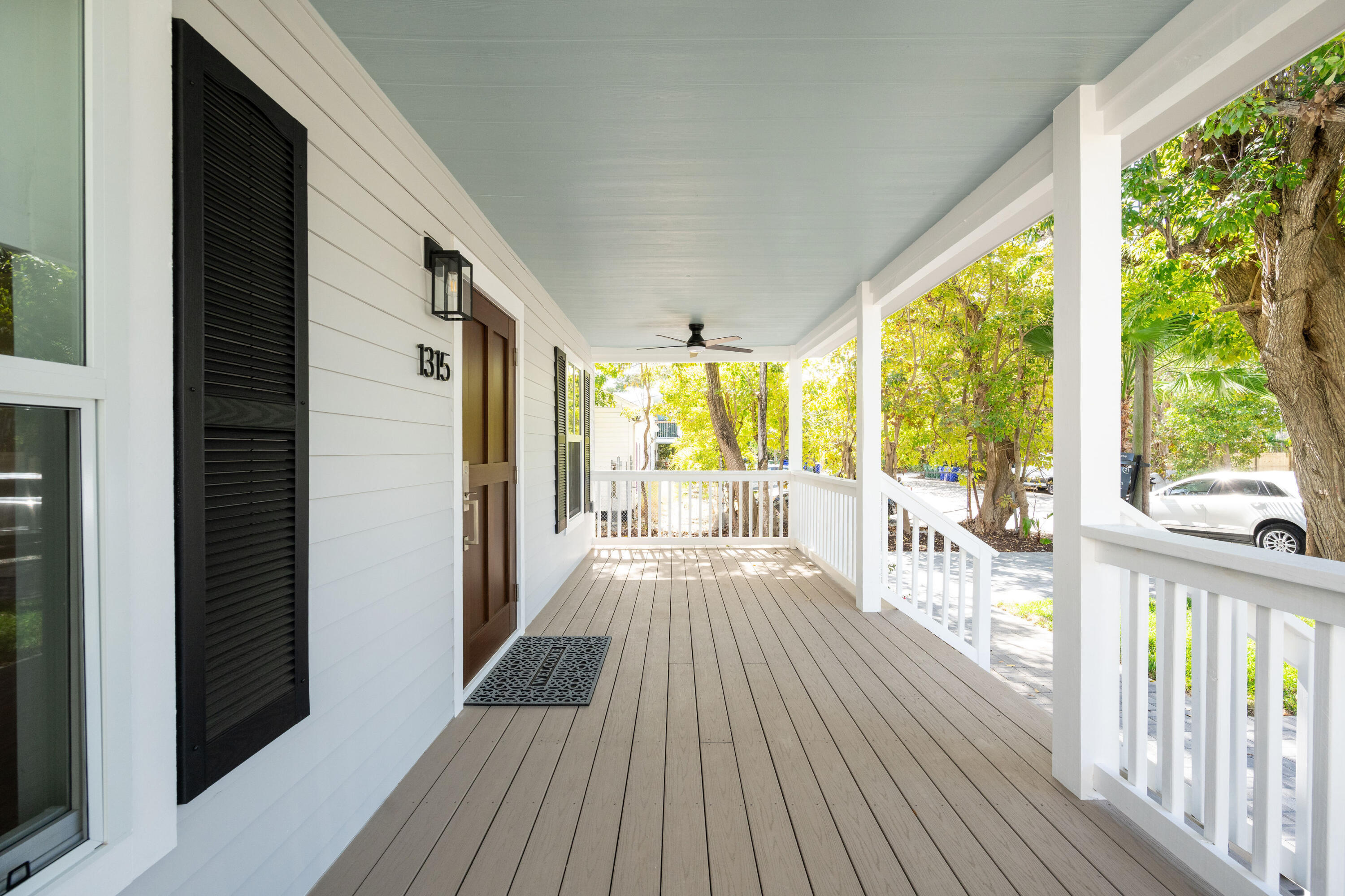1315 William Street Key West, FL 33040 - Photo 15 of 26 a view of a living room with wooden floor and furniture