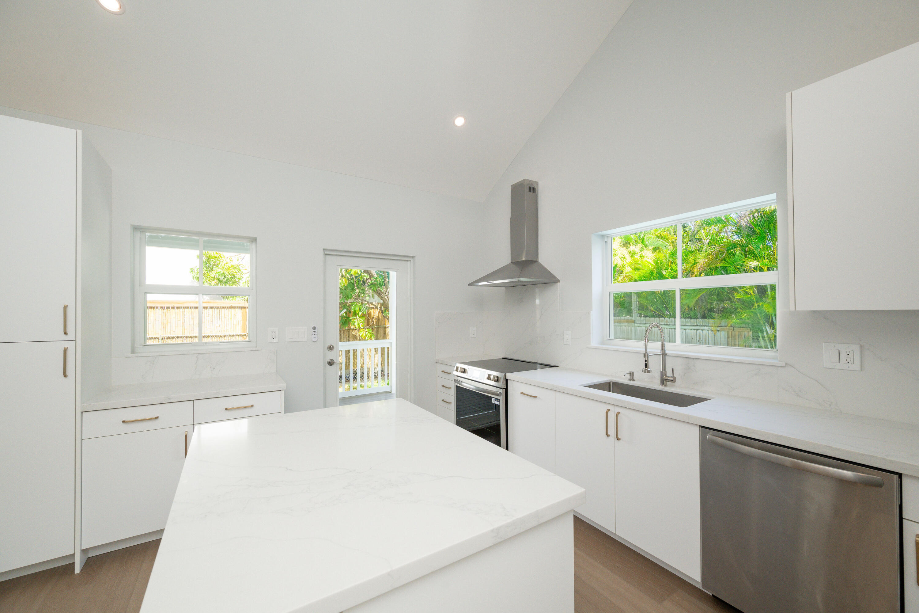 1315 William Street Key West, FL 33040 - Photo 20 of 26 a kitchen with stainless steel appliances a sink stove and window