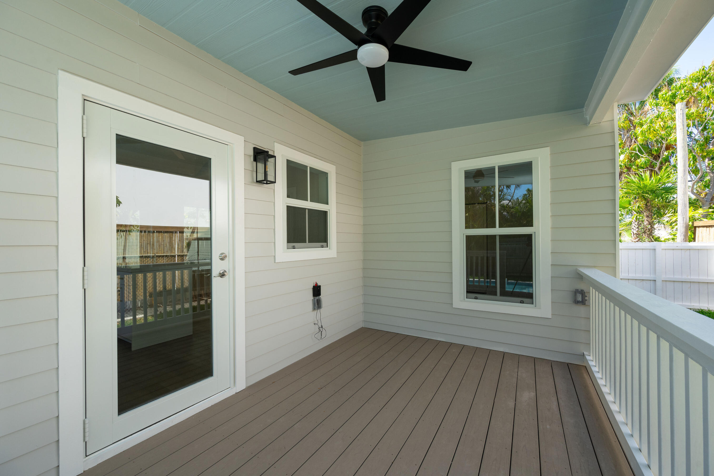 1315 William Street Key West, FL 33040 - Photo 7 of 26 an empty room with wooden floor and windows