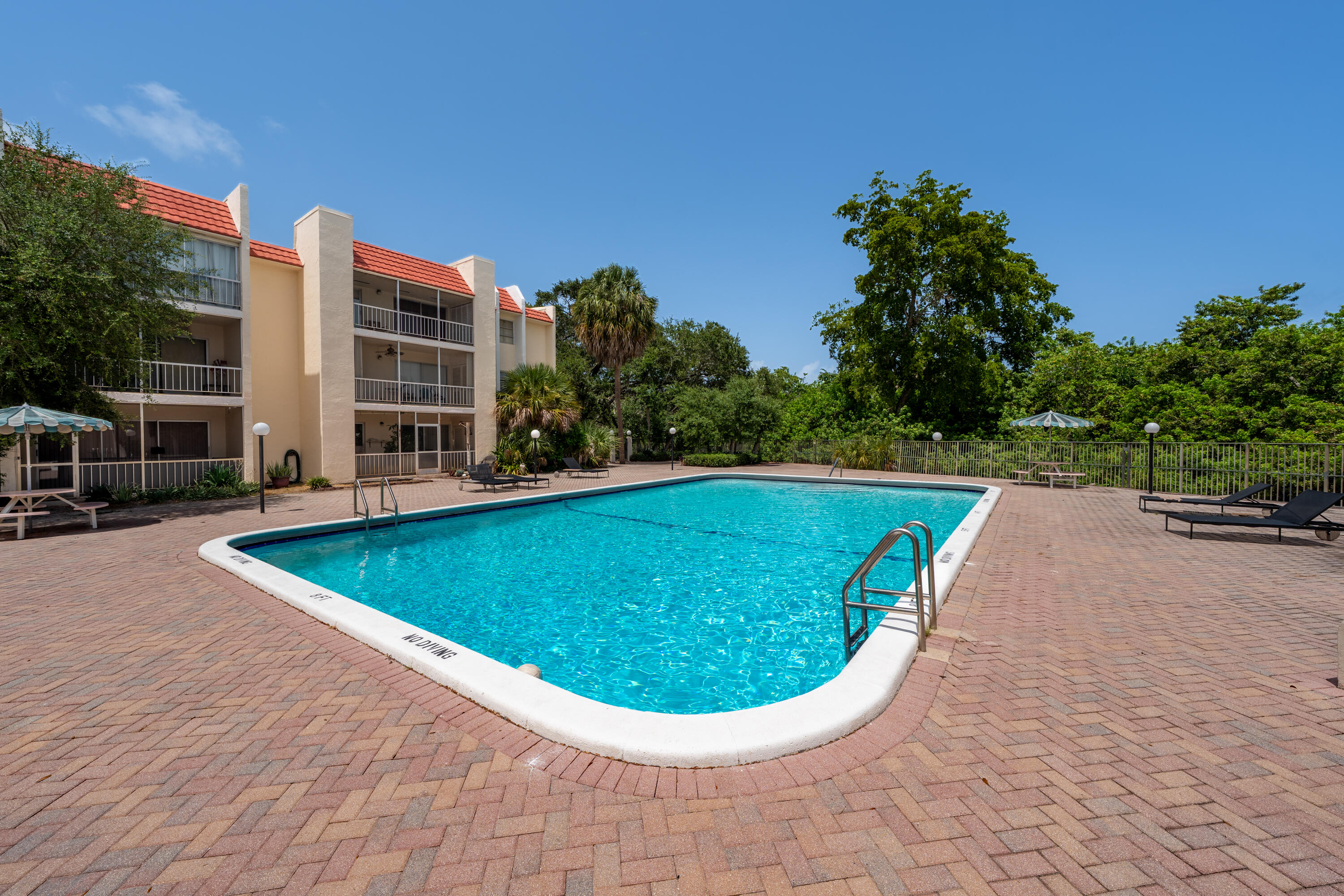 628 Northwest 13th Street, Unit 11 Boca Raton, FL 33486 - Photo 21 of 22 a view of a swimming pool with a yard