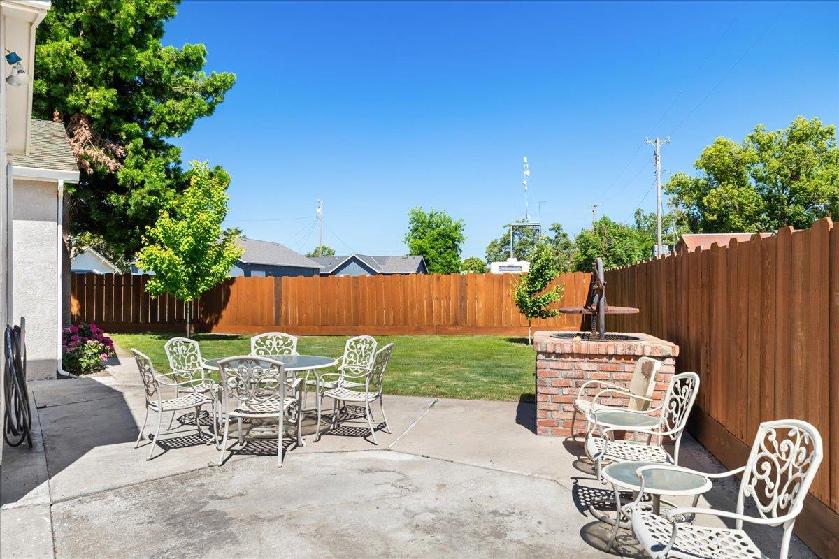 4701 Lone Tree Road Valley Home, CA 95361 - Photo 44 of 59 a view of a chairs and table in patio