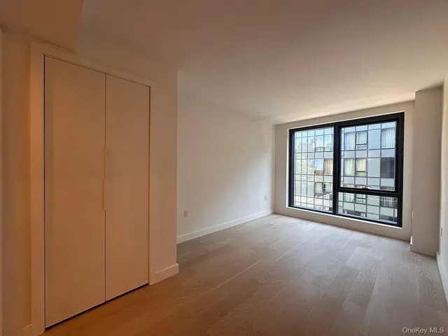 an empty room with windows and entrance