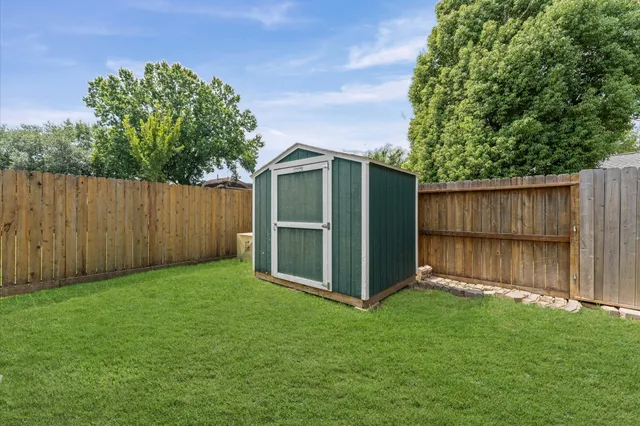 a view of backyard with green space
