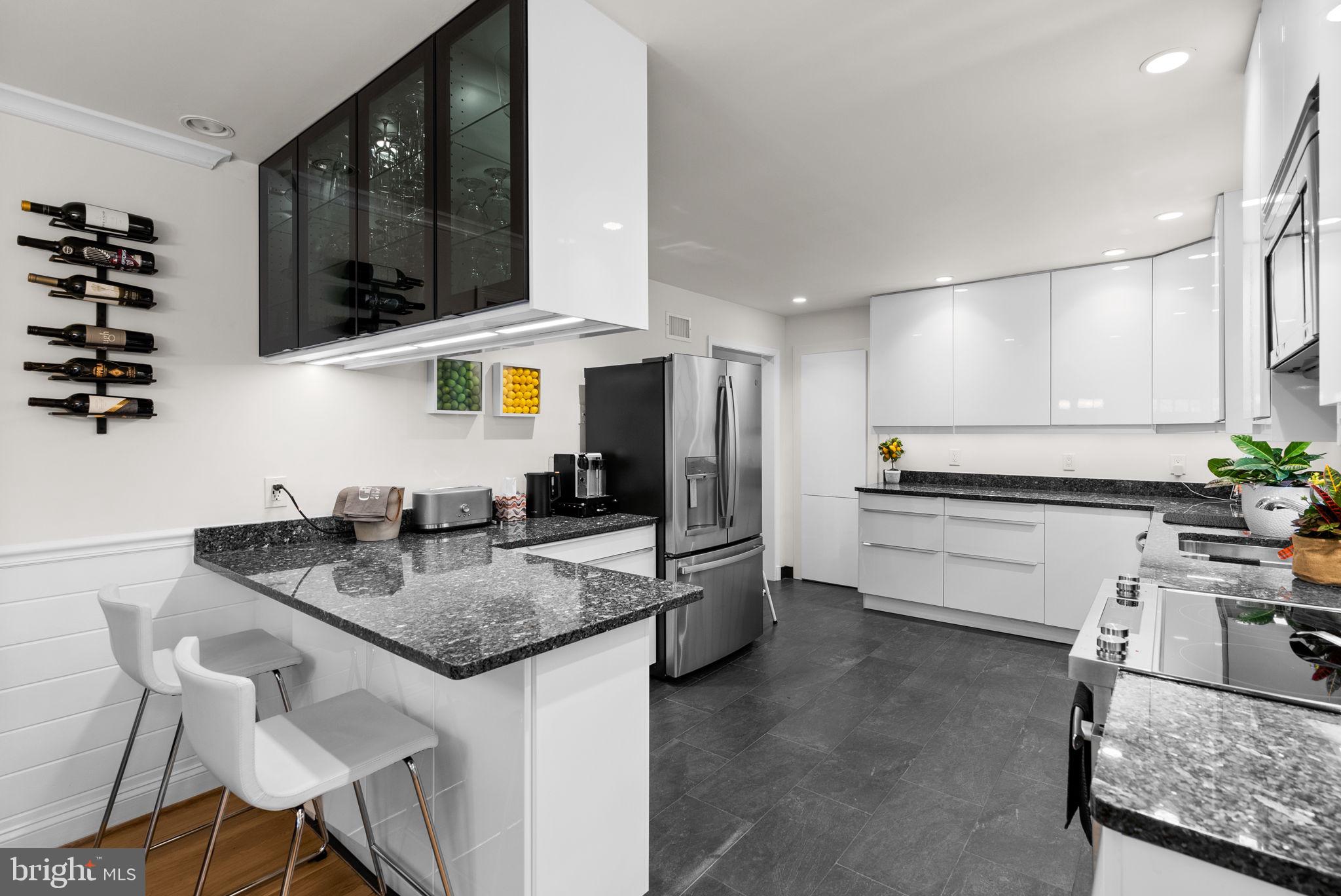4111 Clagett Road Hyattsville, MD 20782 - Photo 12 of 61 a kitchen with stainless steel appliances granite countertop a sink and a refrigerator