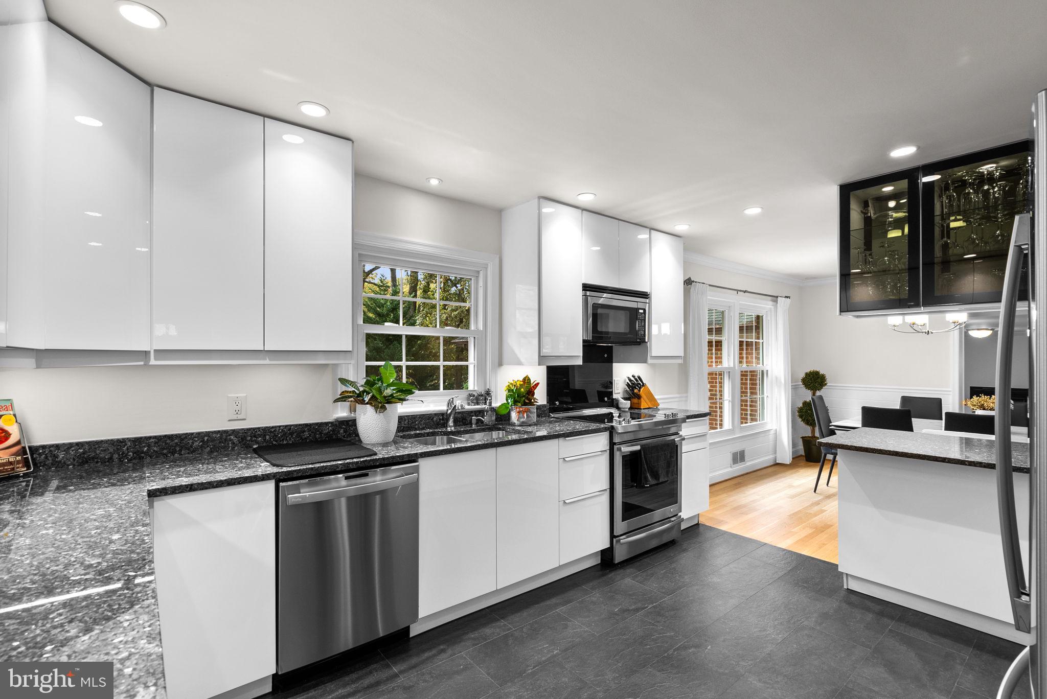 4111 Clagett Road Hyattsville, MD 20782 - Photo 16 of 61 a kitchen with a sink cabinets and stainless steel appliances