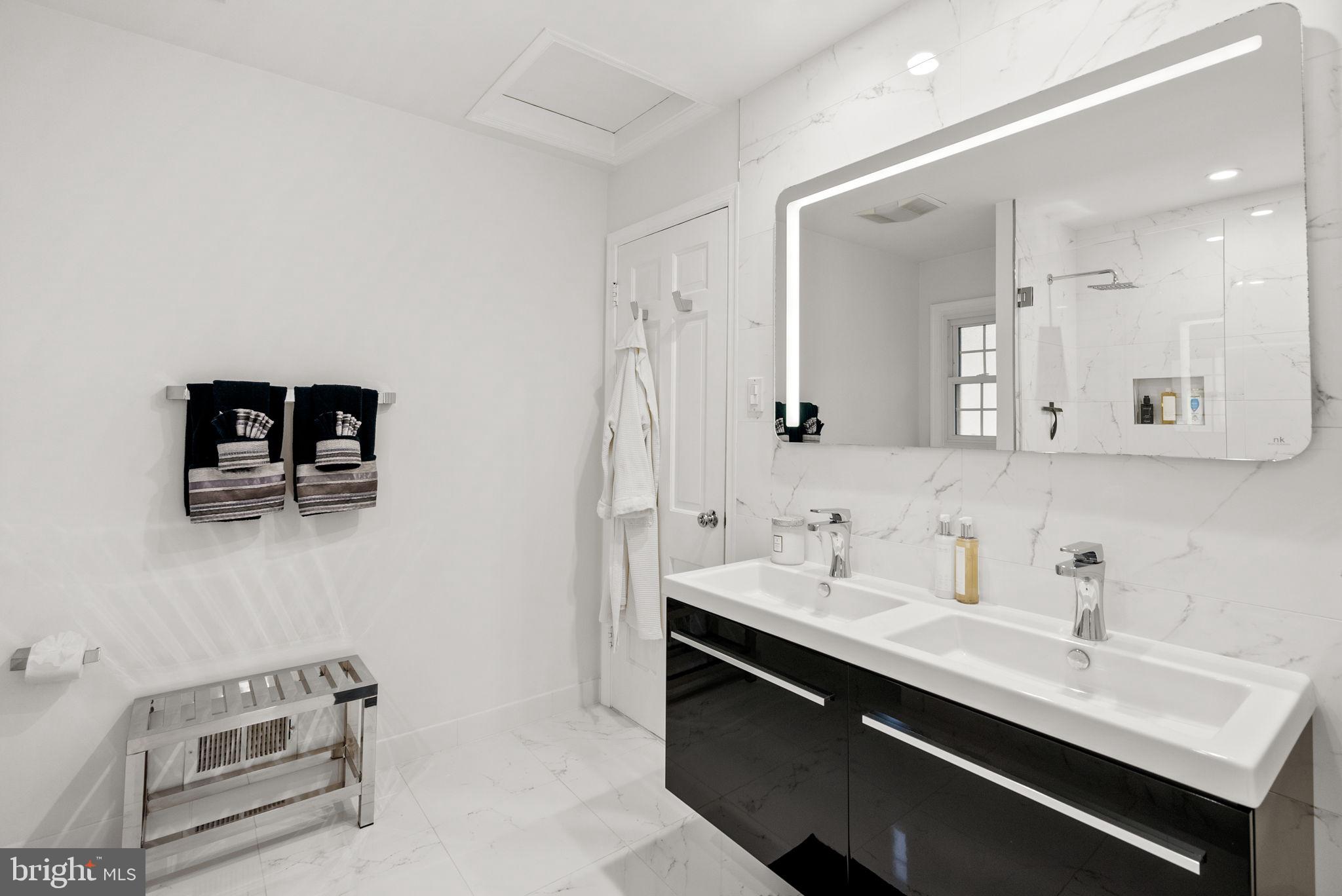 4111 Clagett Road Hyattsville, MD 20782 - Photo 19 of 61 a bathroom with a sink double vanity and a mirror