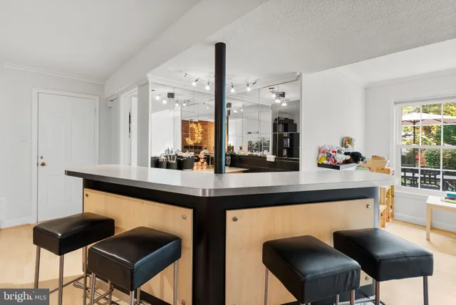 a workspace with furniture and screen on th table