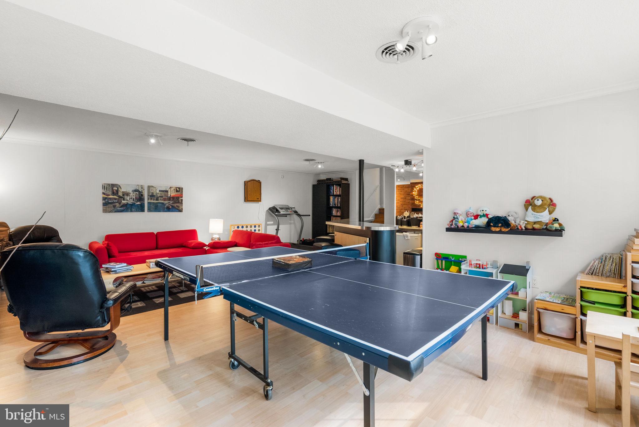4111 Clagett Road Hyattsville, MD 20782 - Photo 36 of 61 a room with furniture a rug and a chandelier