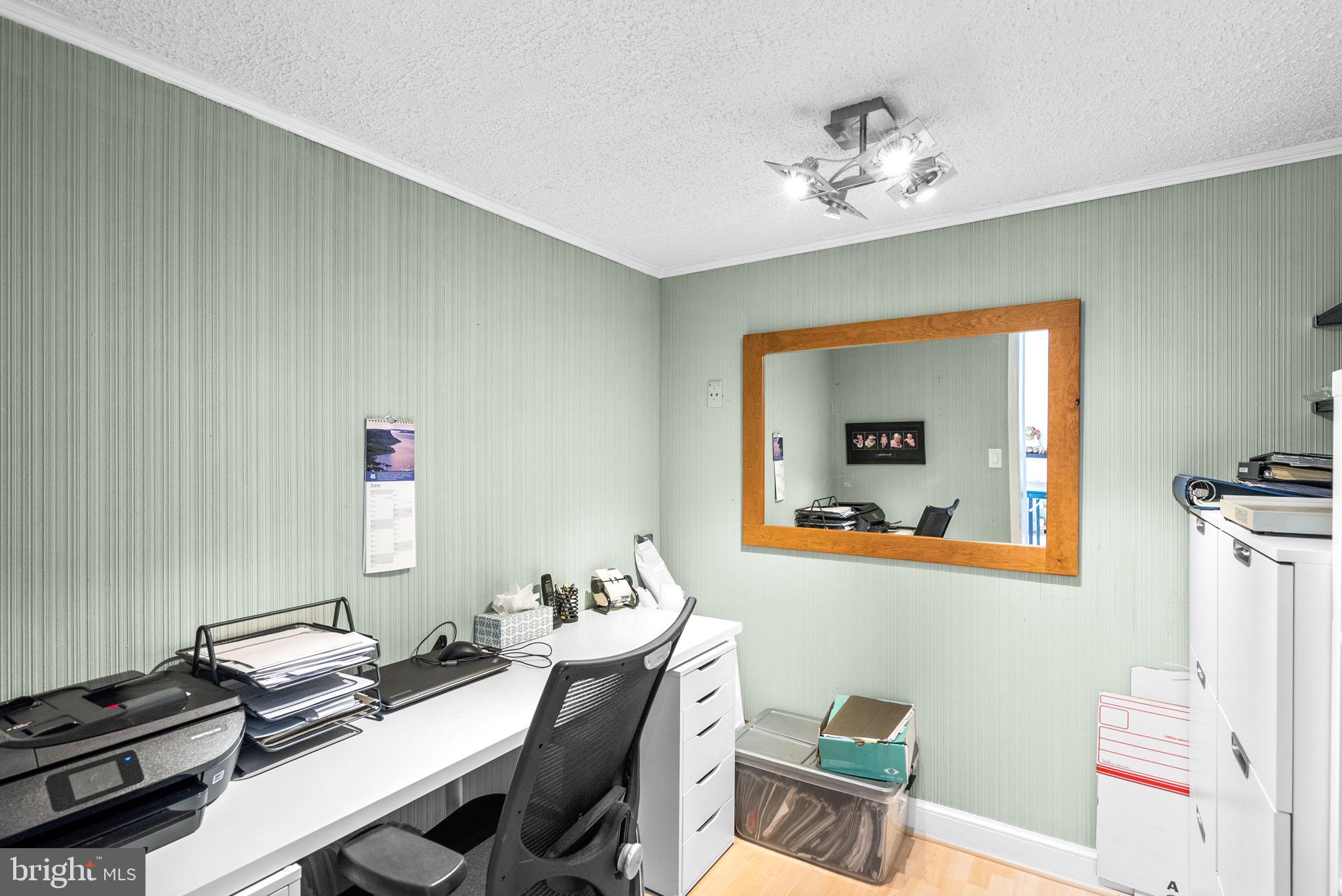 4111 Clagett Road Hyattsville, MD 20782 - Photo 37 of 61 a workspace with furniture and screen on th table