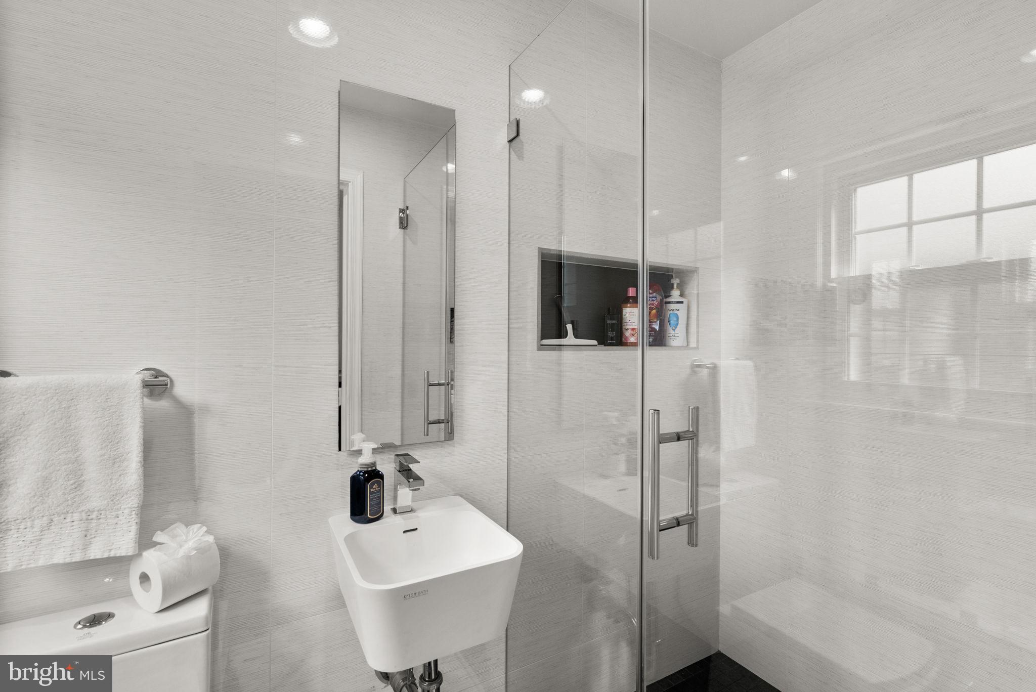 4111 Clagett Road Hyattsville, MD 20782 - Photo 39 of 61 a bathroom with a sink a toilet and shower