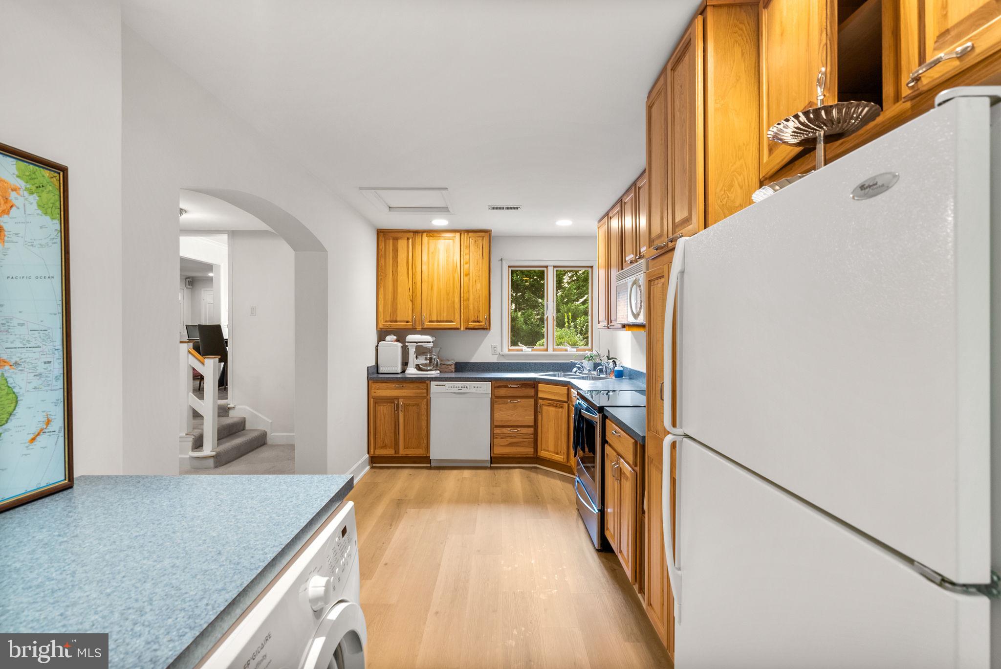 4111 Clagett Road Hyattsville, MD 20782 - Photo 45 of 61 a view of a kitchen with kitchen island a sink a counter top space and stainless steel appliances