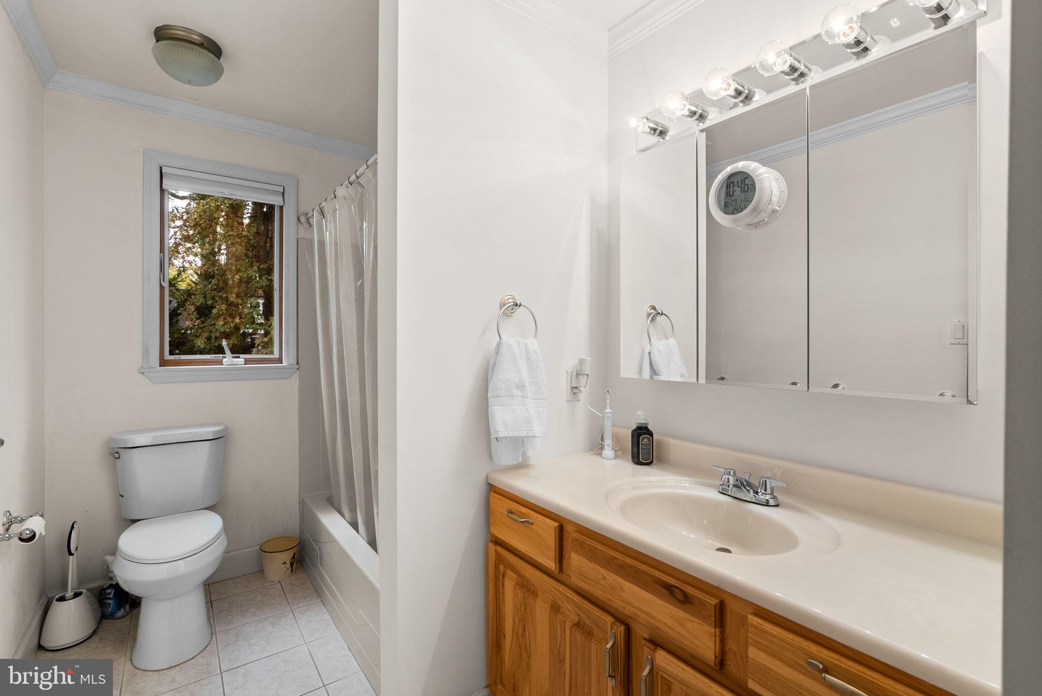 4111 Clagett Road Hyattsville, MD 20782 - Photo 46 of 61 a bathroom with a toilet sink and mirror