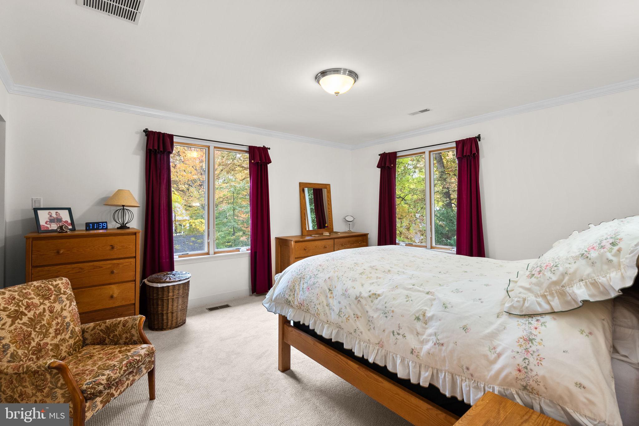 4111 Clagett Road Hyattsville, MD 20782 - Photo 47 of 61 a bedroom with a bed and large windows