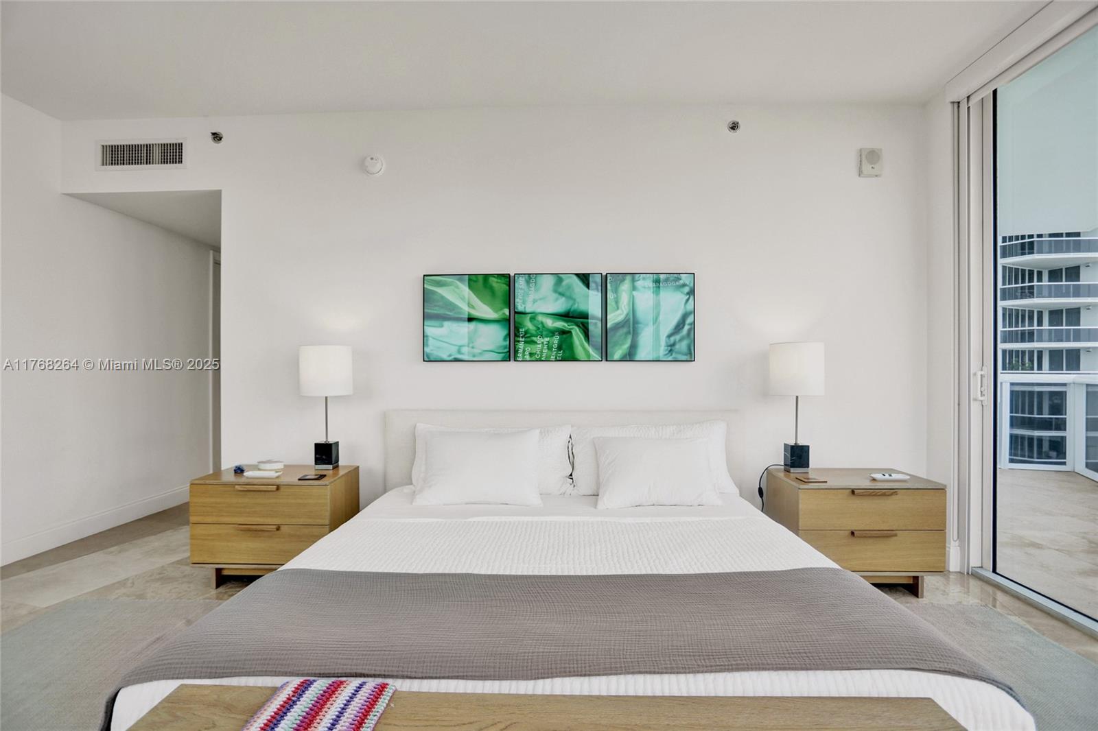 400 Alton Road, Unit 911 Miami Beach, FL 33139 - Photo 11 of 24 a bedroom with a bed and window